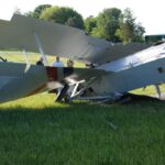 Left-rear view showing the smashed landing gear.