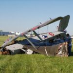Lower left wing was almost twisted off of the fuselage and its wing-tip was torn away.